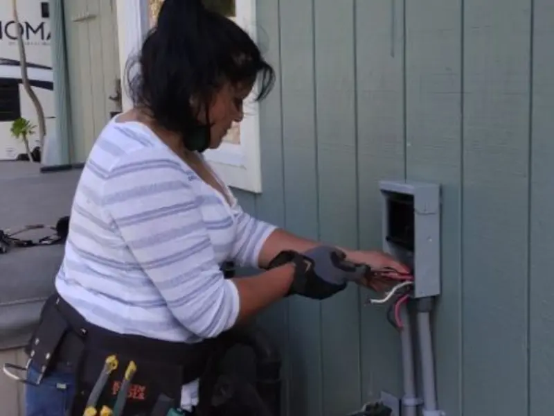 Licensed electrician wiring an exterior subpanel in Helena Valley Northwest