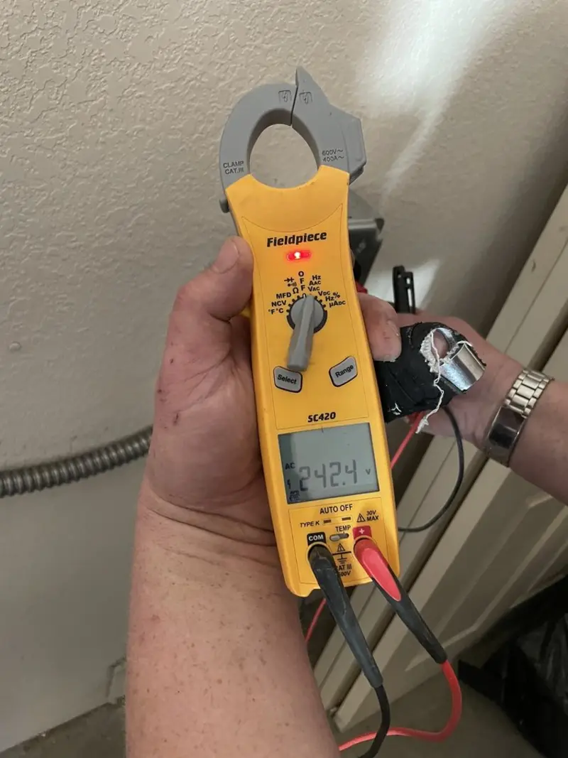 Voltage testing with clamp meter during Generator Installation in Helena Valley Northwest